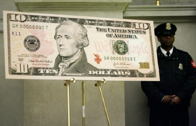 An enlarged print of the $10 bill is displayed on the first day of circulation of the new notes at the rotunda of the National Archives, March 2, 2006, in Washington, D.C.